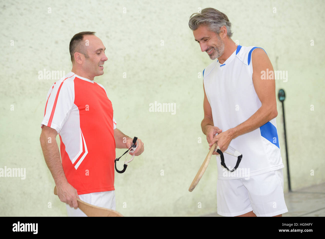 Sportsmen with wooden rackets Stock Photo - Alamy