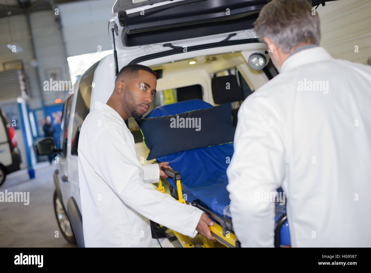 putting the bed in the ambulance Stock Photo Alamy
