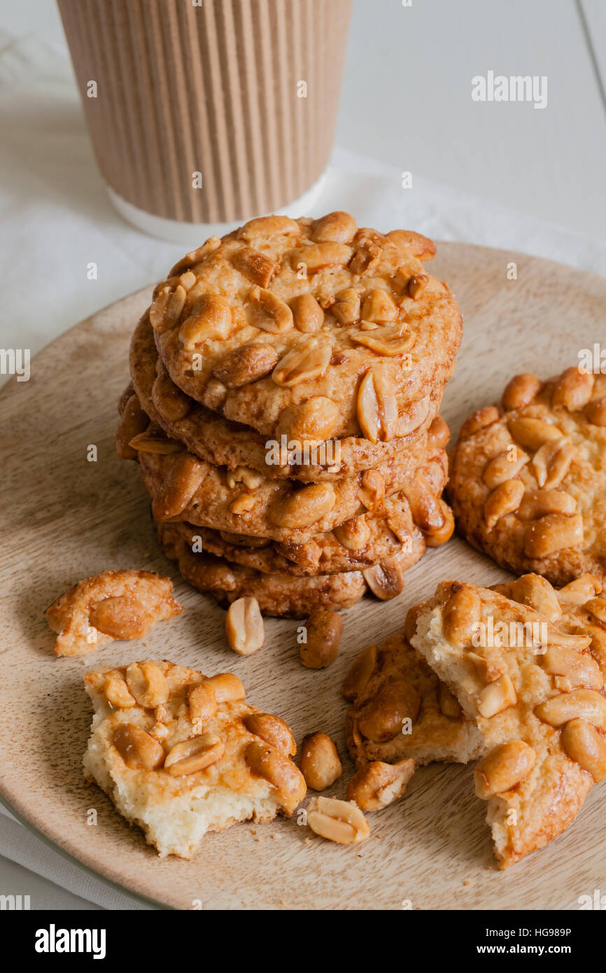 Salted crunchy peanut cookies freshly baked with crumbs and pieces on a
