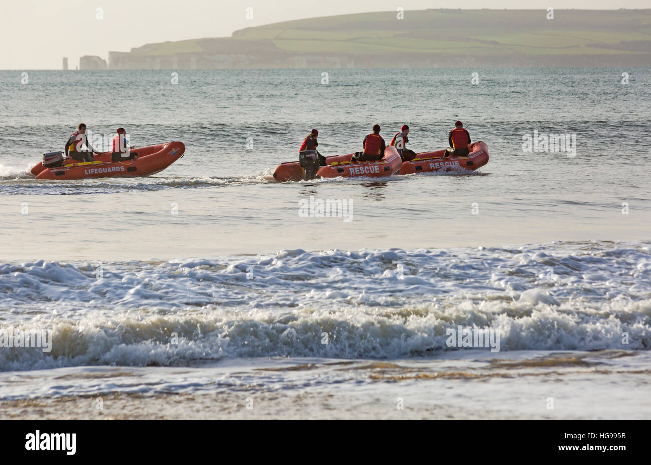 Bournemouth Lifeguard Corps give a demonstration of their lifesaving skills in the sea at Durley Chine Bournemouth, Dorset UK on Boxing Day Stock Photo