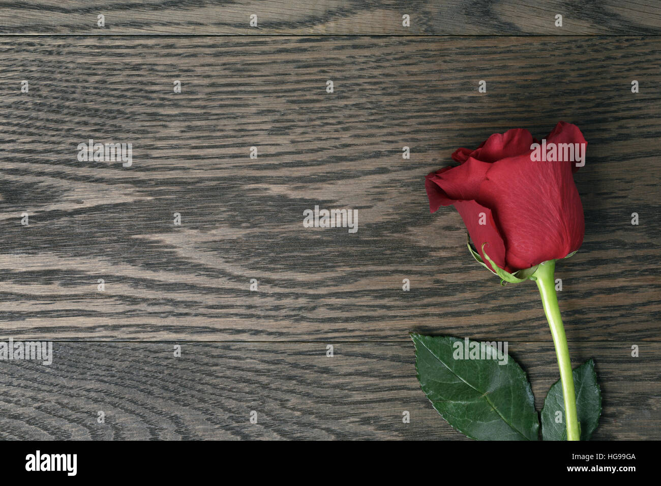 romantic background with red rose on wood table from above Stock Photo ...