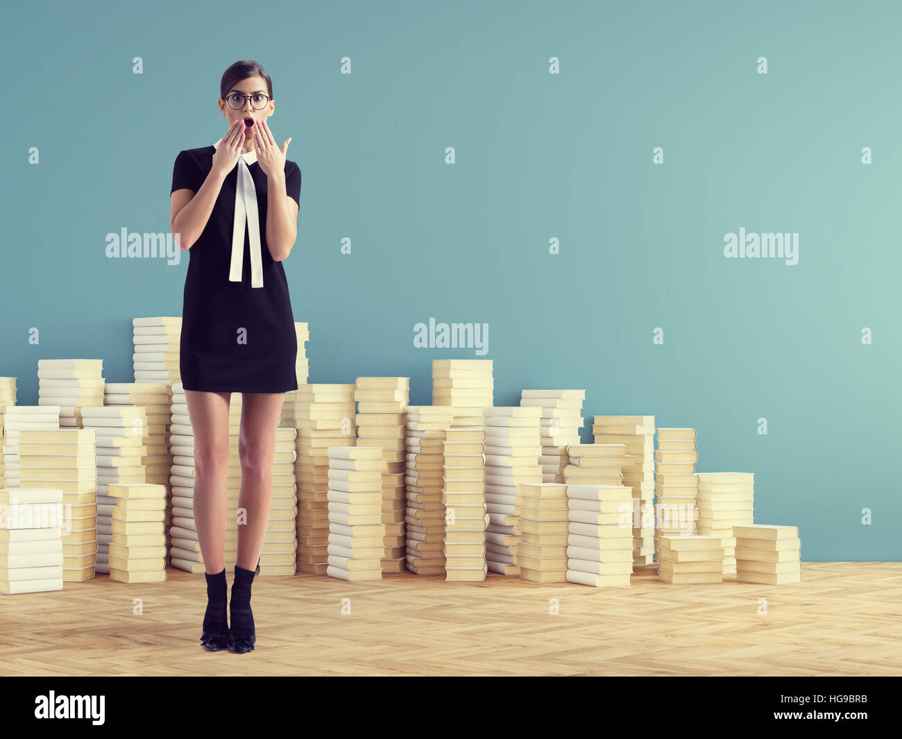 young woman standing infront of stack books. education concept. Stock Photo