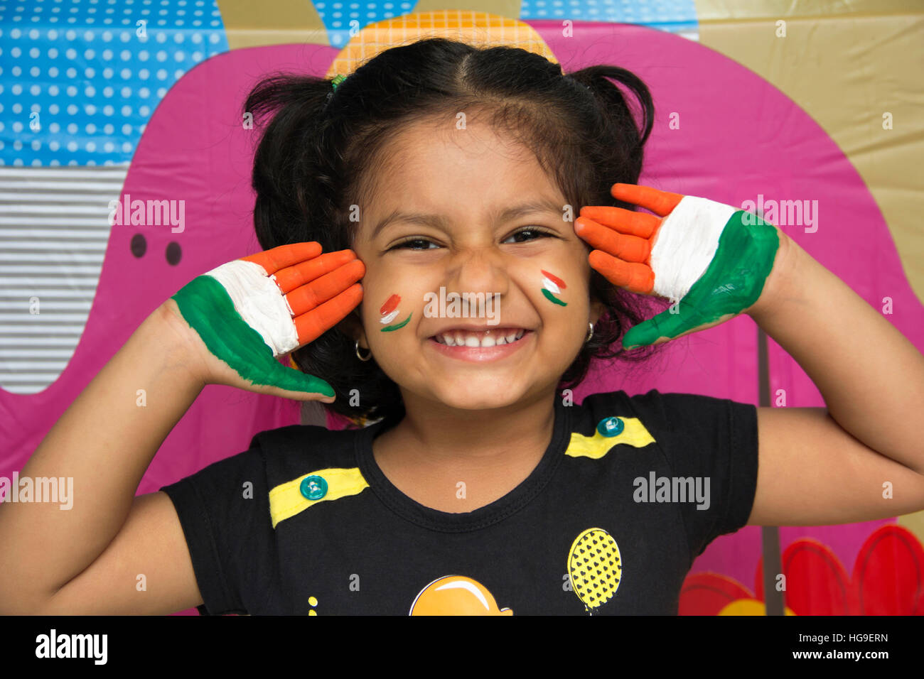 Indian Child Color Hand Little smiling Indian girl showing hands painted with Indian tri colour ...
