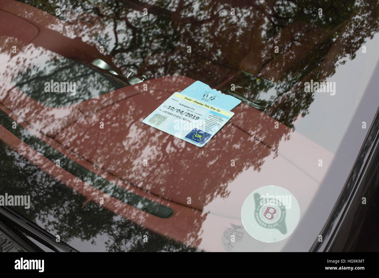 A Blue badge in a car Stock Photo