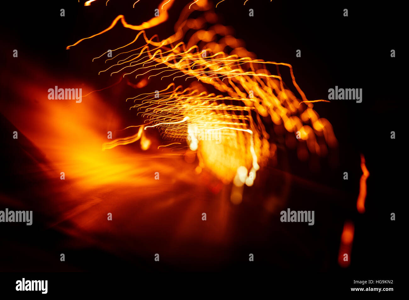 Red abstract trails of light on dark background. Long exposure Stock ...