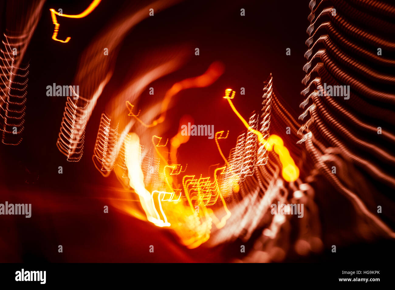 Red abstract trails of light on dark background. Long exposure Stock ...