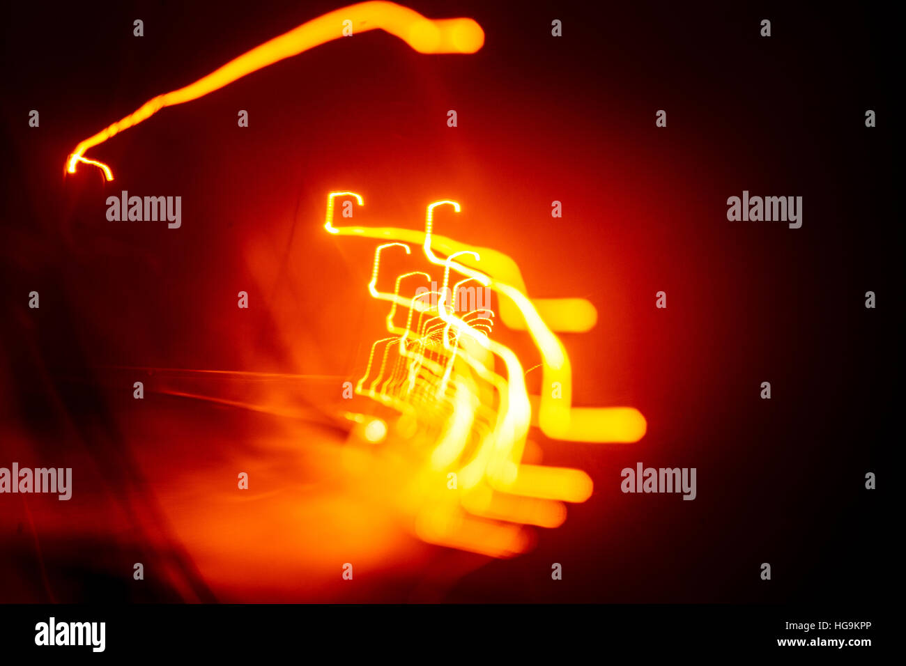 Red abstract trails of light on dark background. Long exposure Stock ...