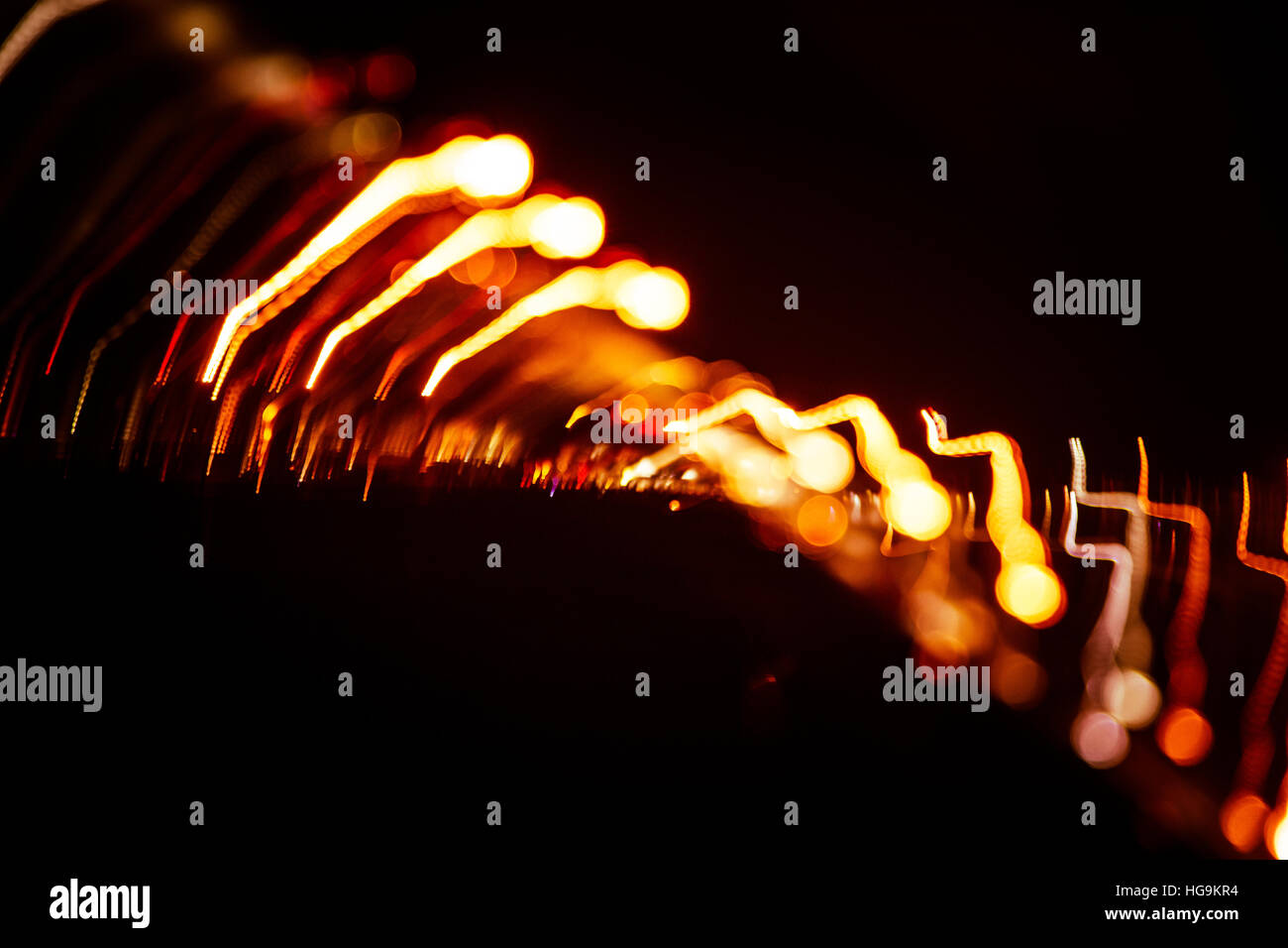 Red abstract trails of light on dark background. Long exposure Stock ...