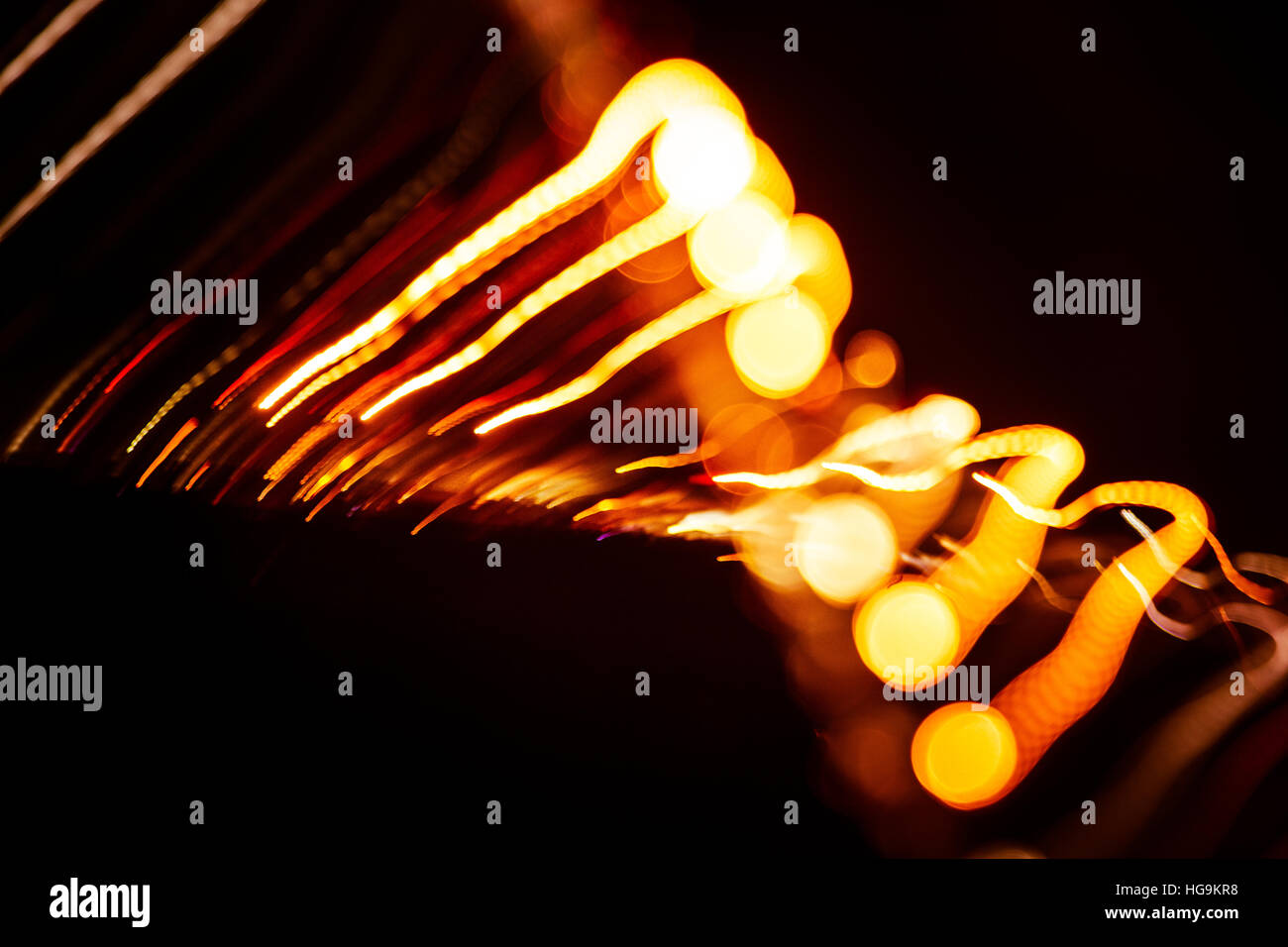Red abstract trails of light on dark background. Long exposure Stock ...