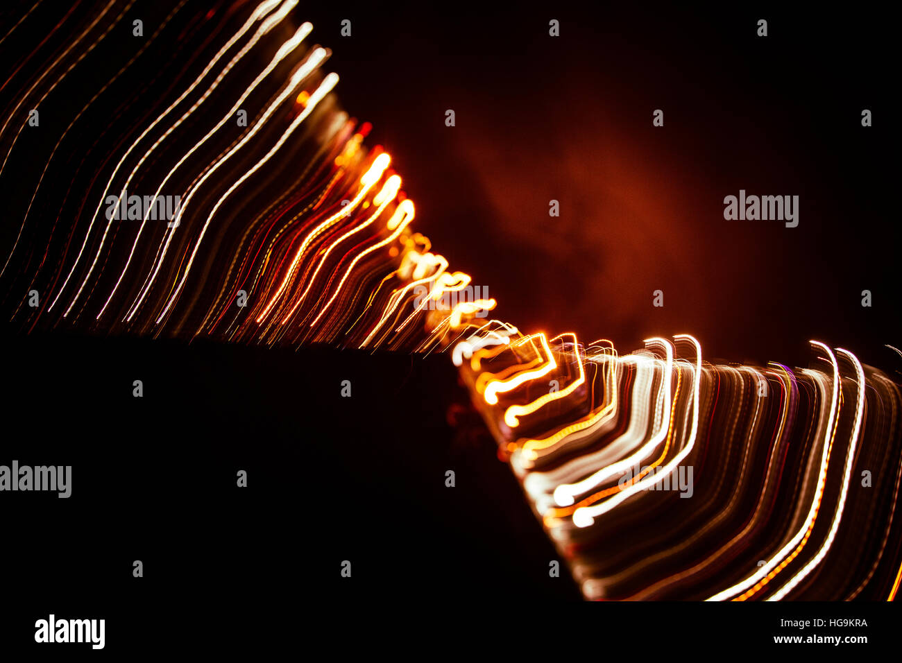 Red abstract trails of light on dark background. Long exposure Stock ...