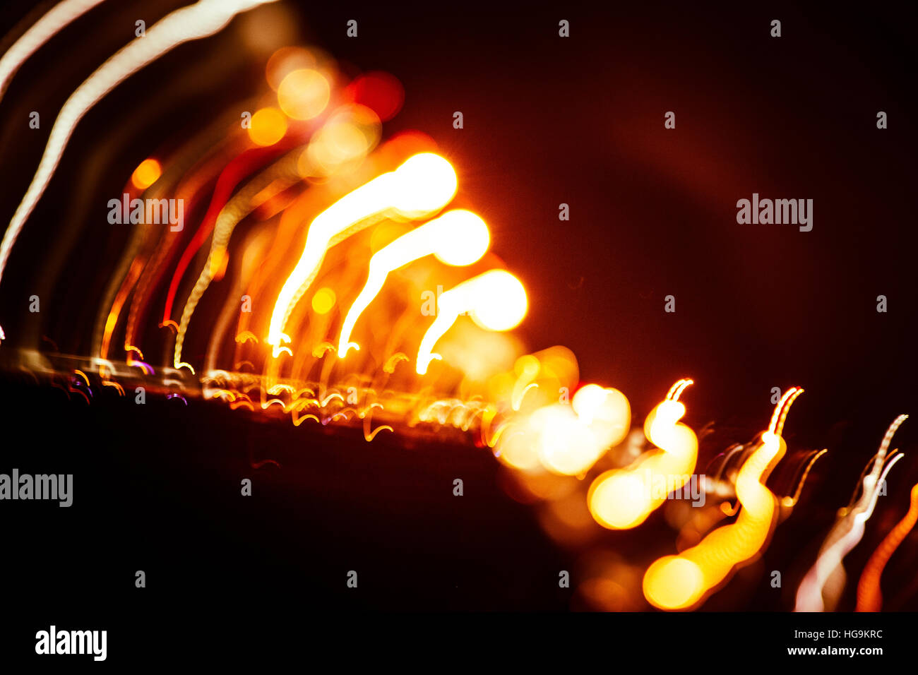 Red abstract trails of light on dark background. Long exposure Stock ...