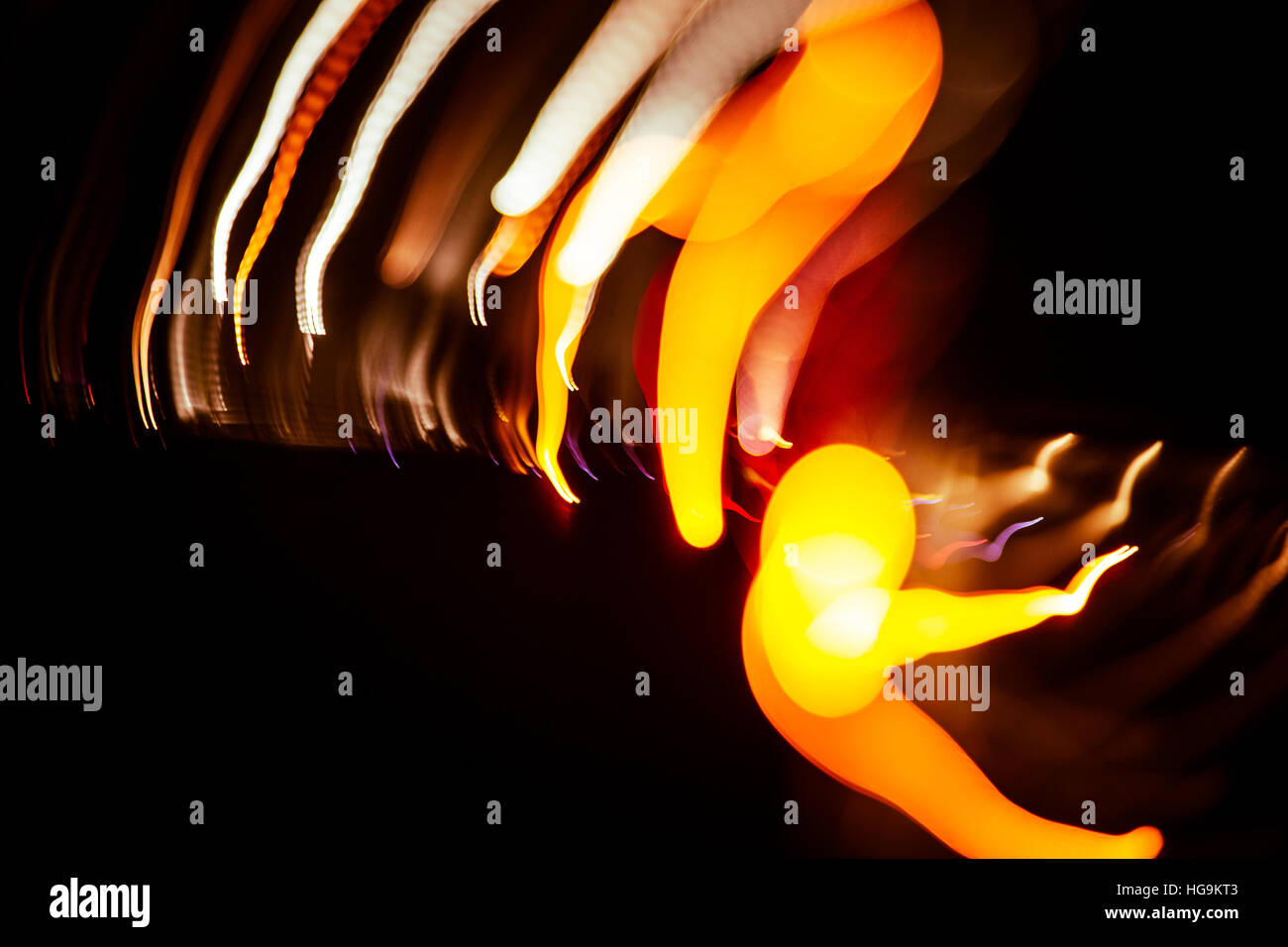Red abstract trails of light on dark background. Long exposure Stock ...