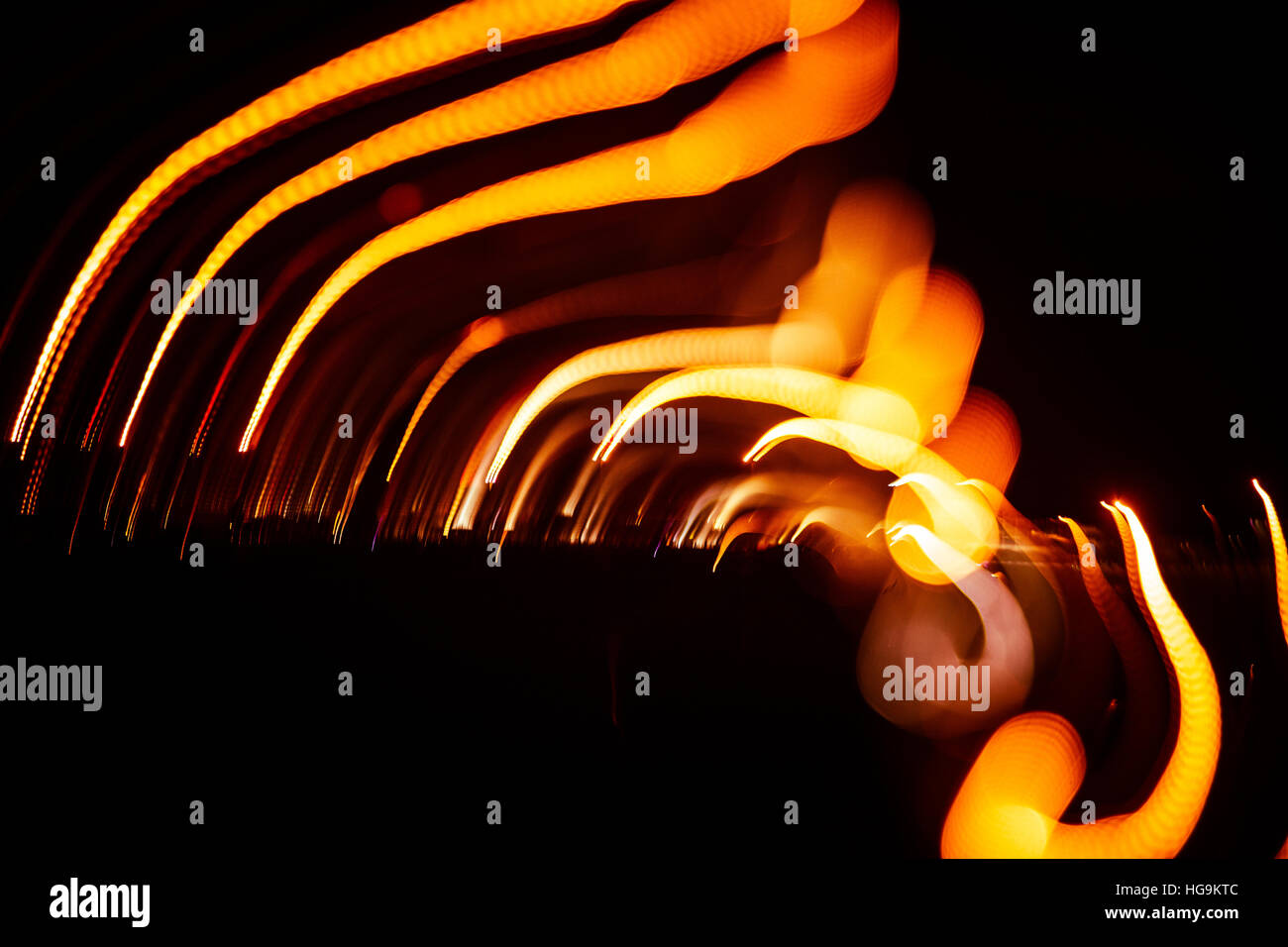 Red abstract trails of light on dark background. Long exposure Stock ...