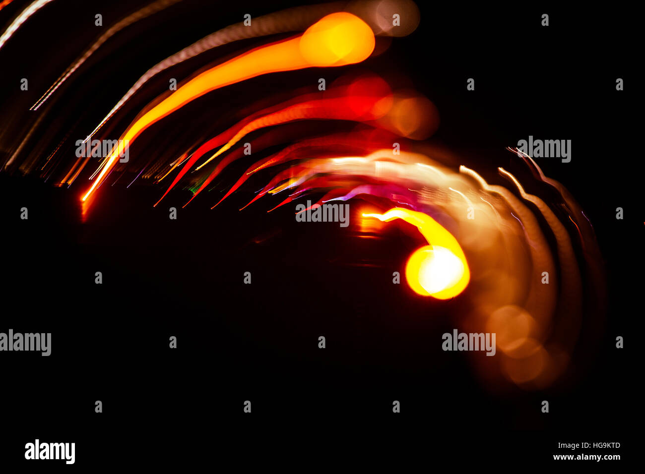 Red abstract trails of light on dark background. Long exposure Stock ...