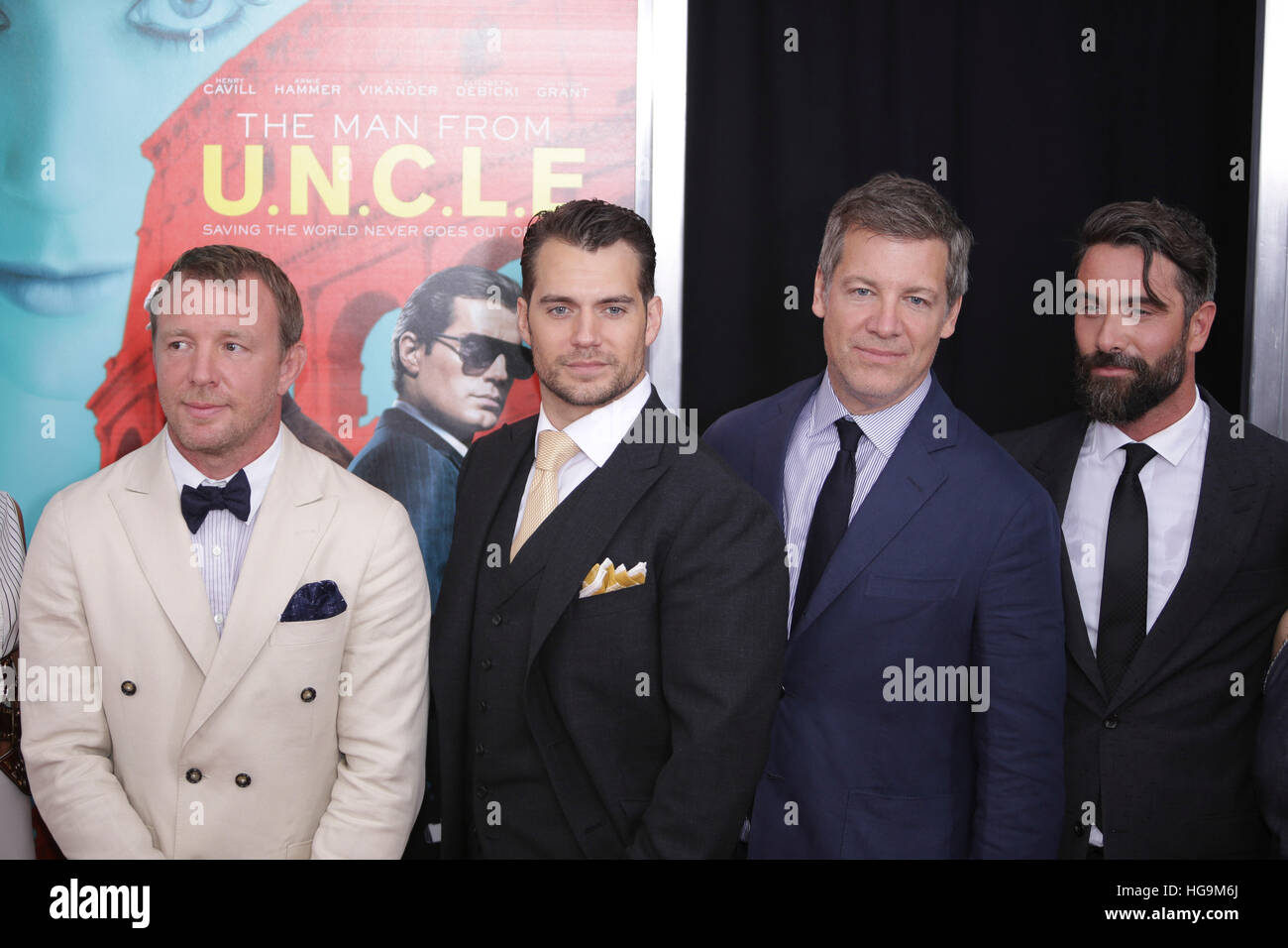 Guy Ritchie, Henry Cavill, Lionel Wigram and Luca Cavalli arrive at The Man From U.N.C.L.E premiere at the Zigfield Theater in NYC. Stock Photo