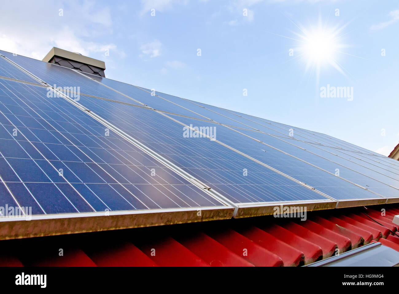 Roof of a house with solar cells Stock Photo