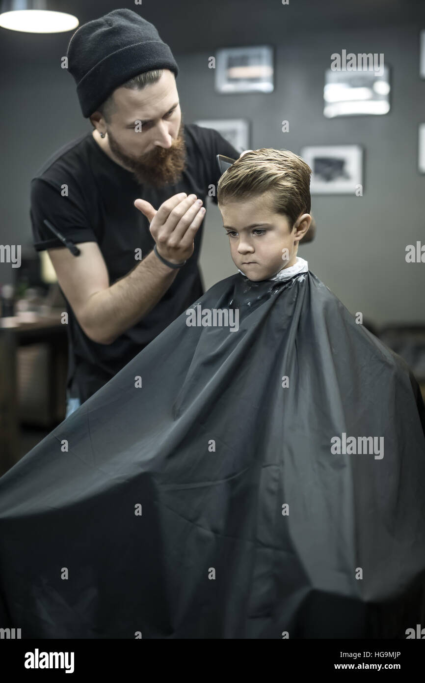 Kid's hair styling in barbershop Stock Photo - Alamy