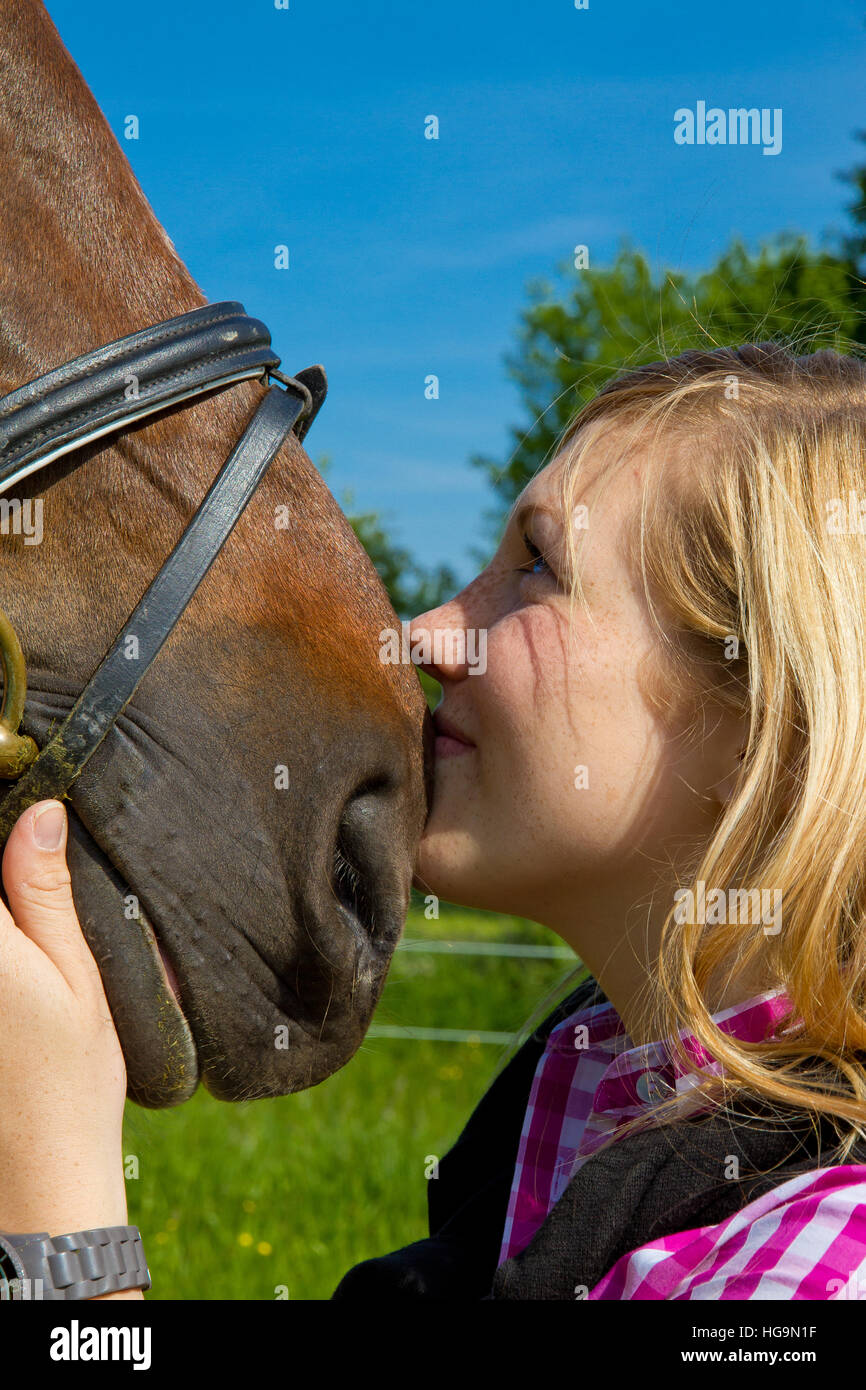 Teenage girl love her horse Stock Photo