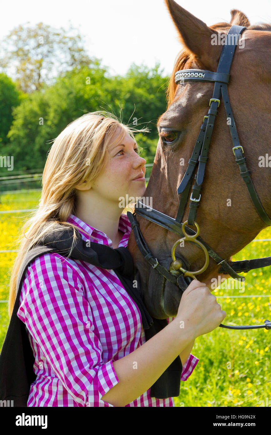 Young woman and her horse Stock Photo