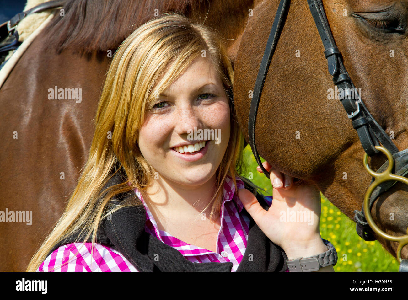 Portrait of a smiling teenager with her horse Stock Photo