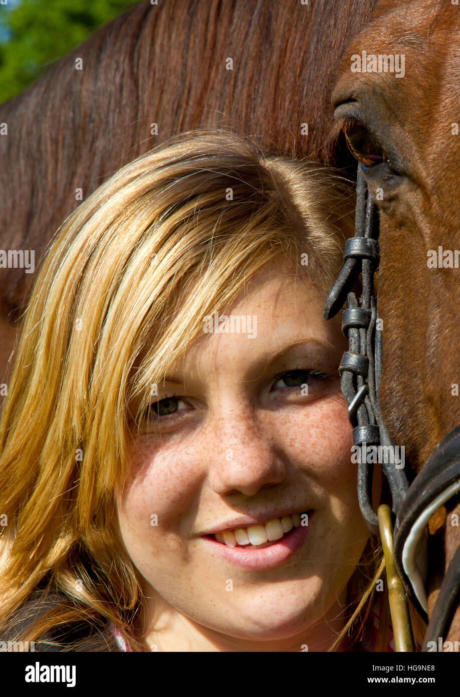 Portrait of a happy teenager with horse Stock Photo