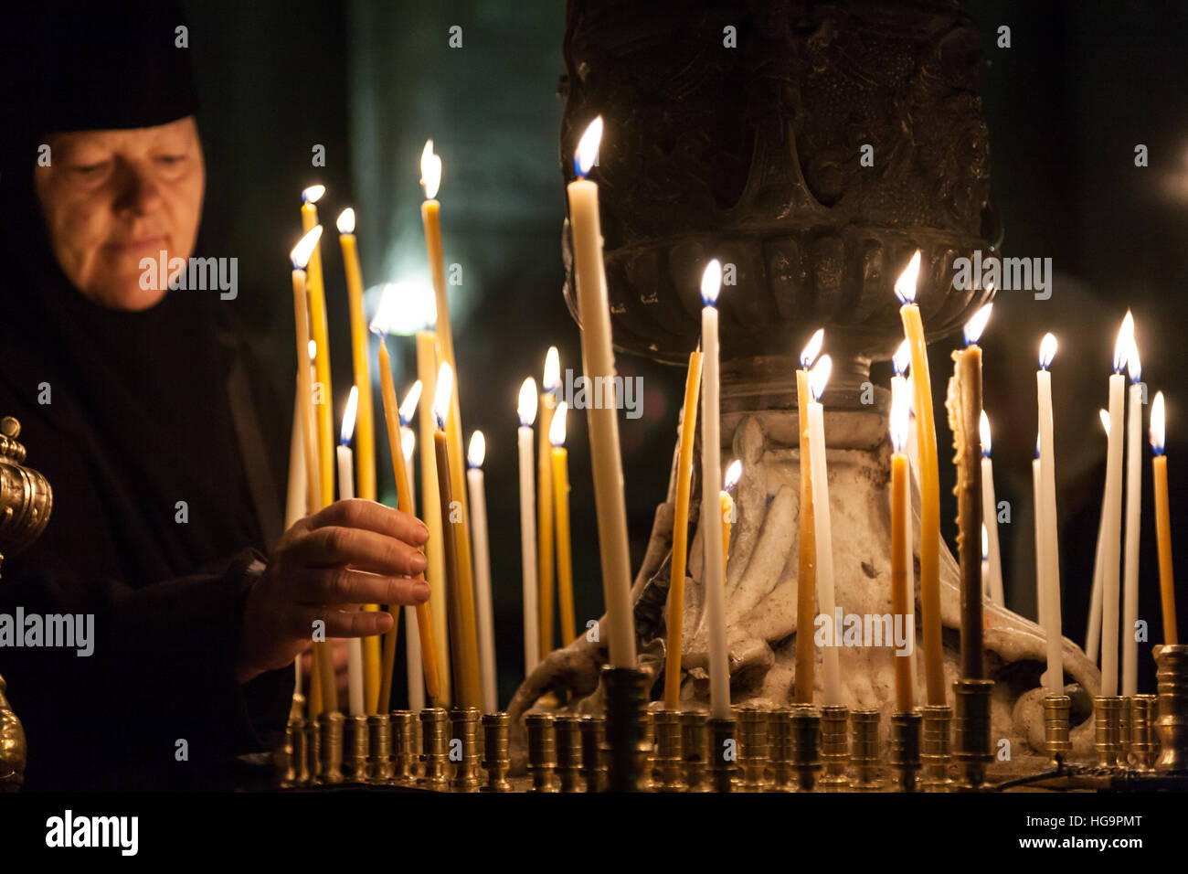 Nun candle hi-res stock photography and images - Alamy