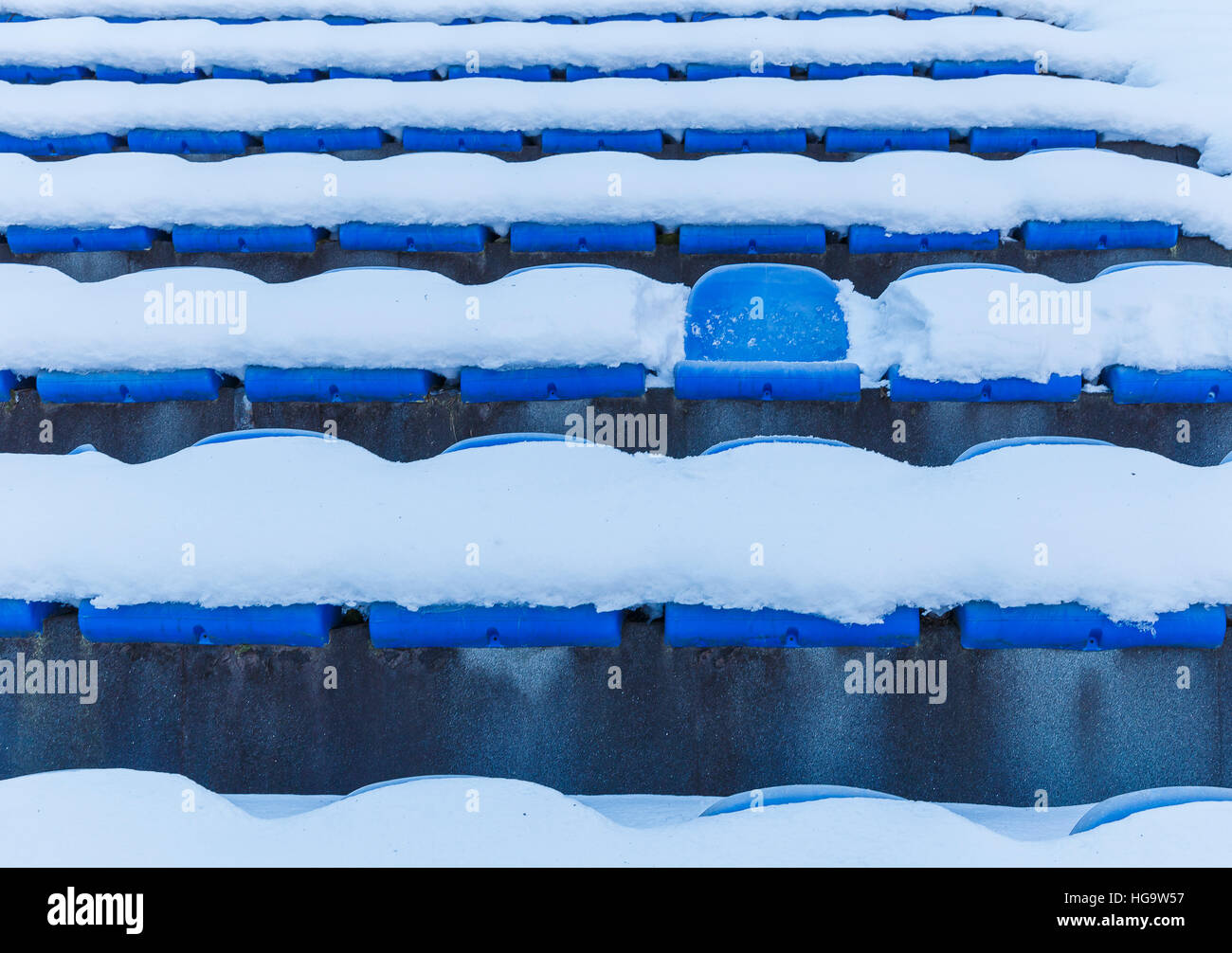 The old plastic seats in an abandoned stadium Stock Photo