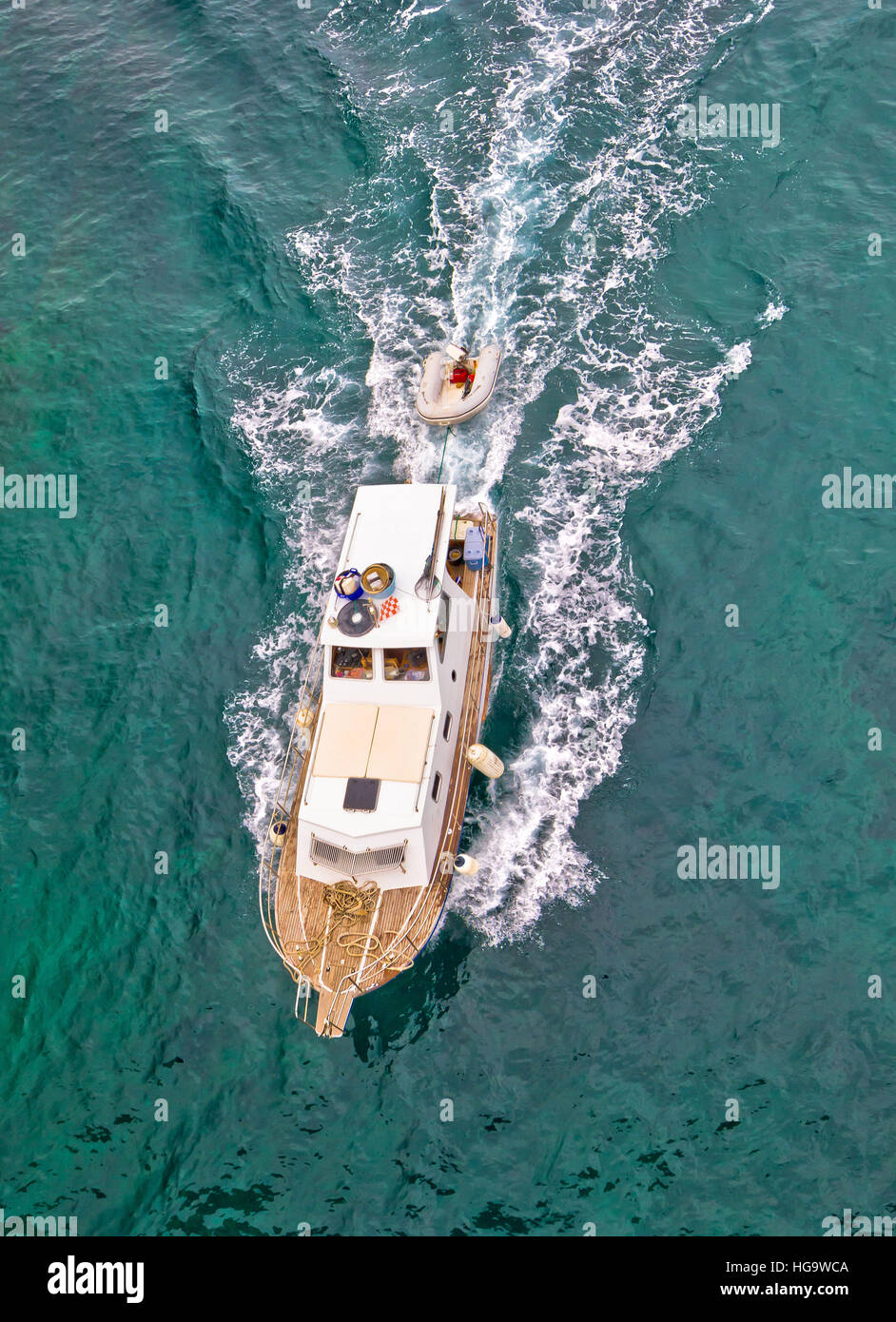 Fishing trawler on blue sea aerial vertical view Stock Photo