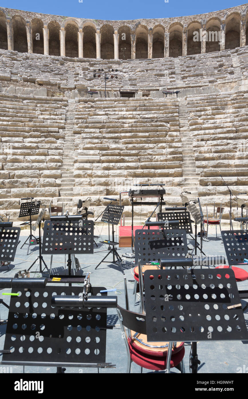 Aspendos, Antalaya Province, Turkey.  The Roman theatre which is still in use.  Orchestral equipment on stage in preparation for a performance. Stock Photo