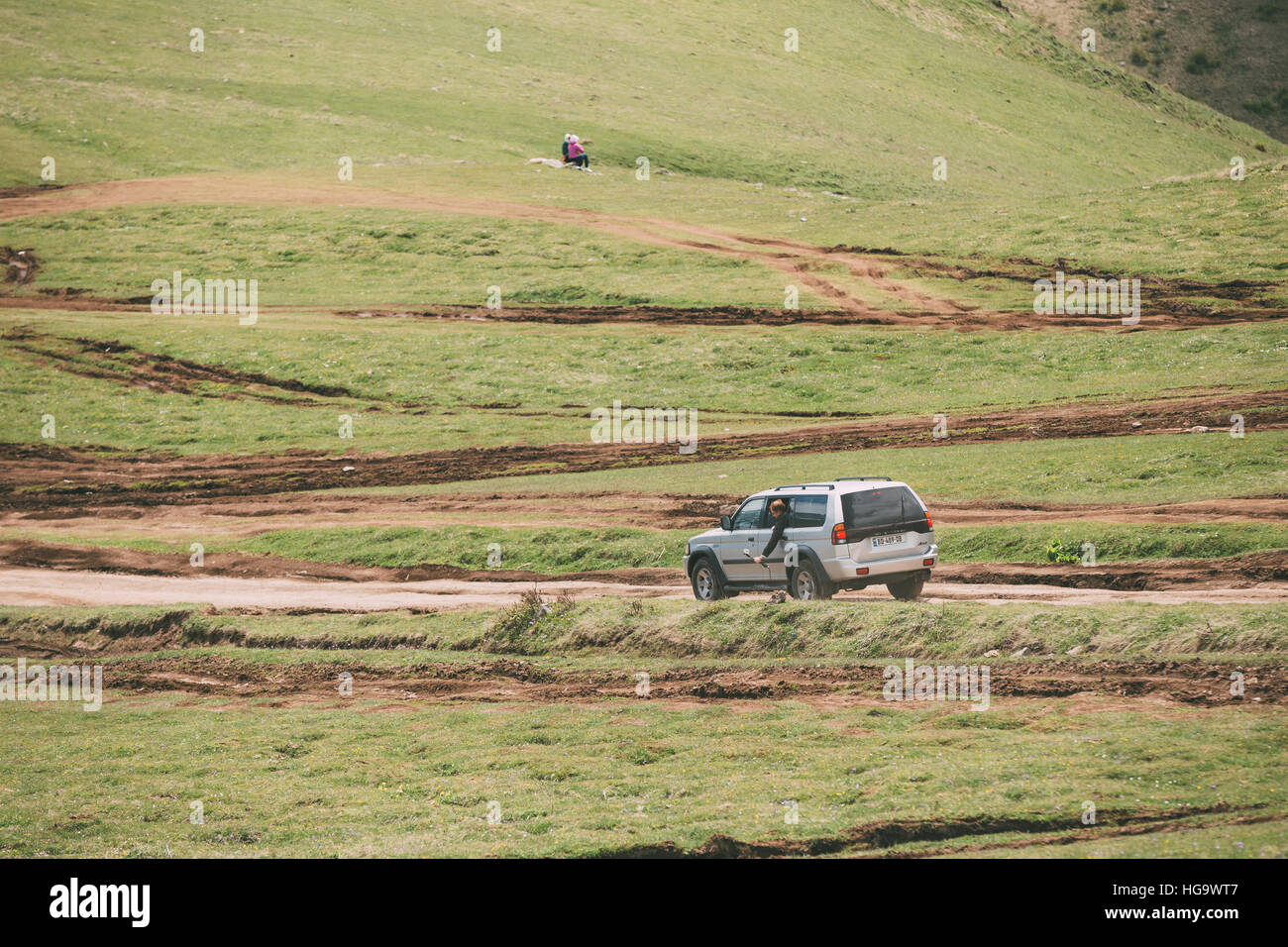 Kazbegi, Gergia - May 23, 2016: Mitsubishi Montero Sport SUV driving on off road in summer meadow. Mitsubishi Pajero Sport is a mid-size SUV produced Stock Photo