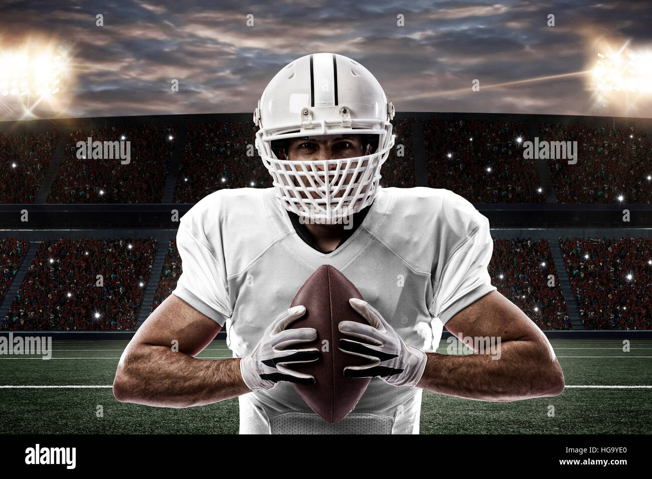Football Player with a white uniform on a stadium Stock Photo Alamy