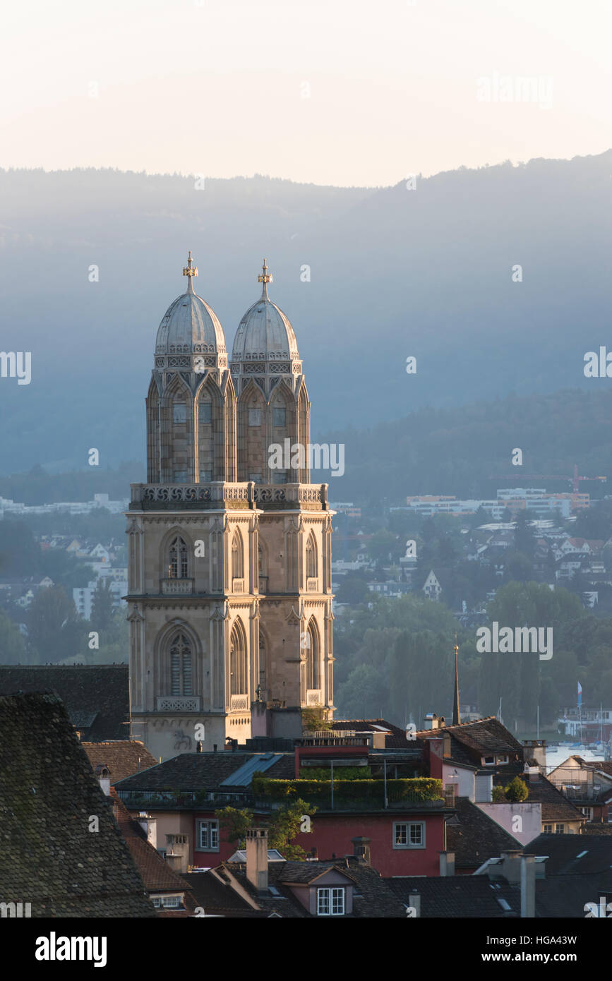 The twin towers of Zurich's medieval Grossmunster cathedral in the sunset Stock Photo