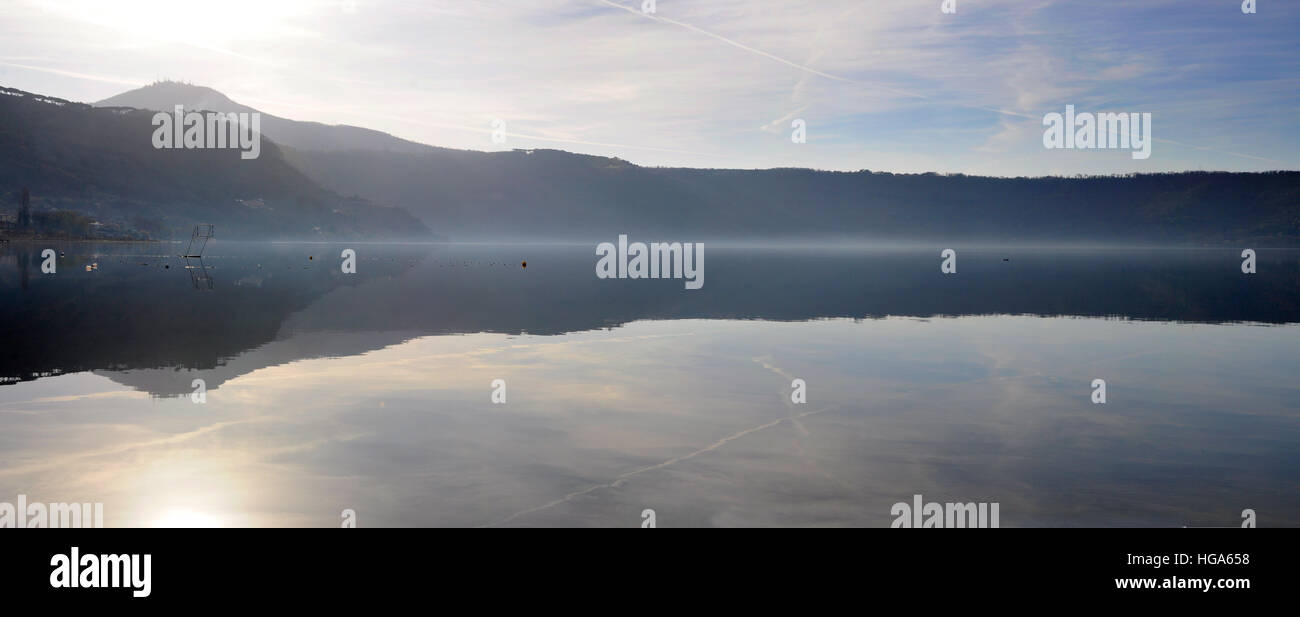 Panorama of Castel Gandolfo lake with hills reflecting on the calm water Stock Photo