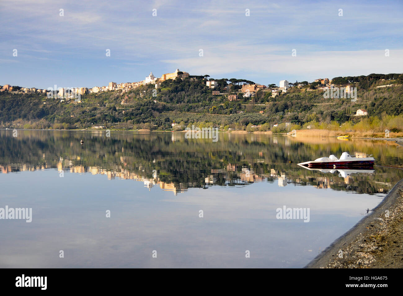 The town of Castel Gandolfo, the summer residence of the popes, reflecting on its lake Stock Photo