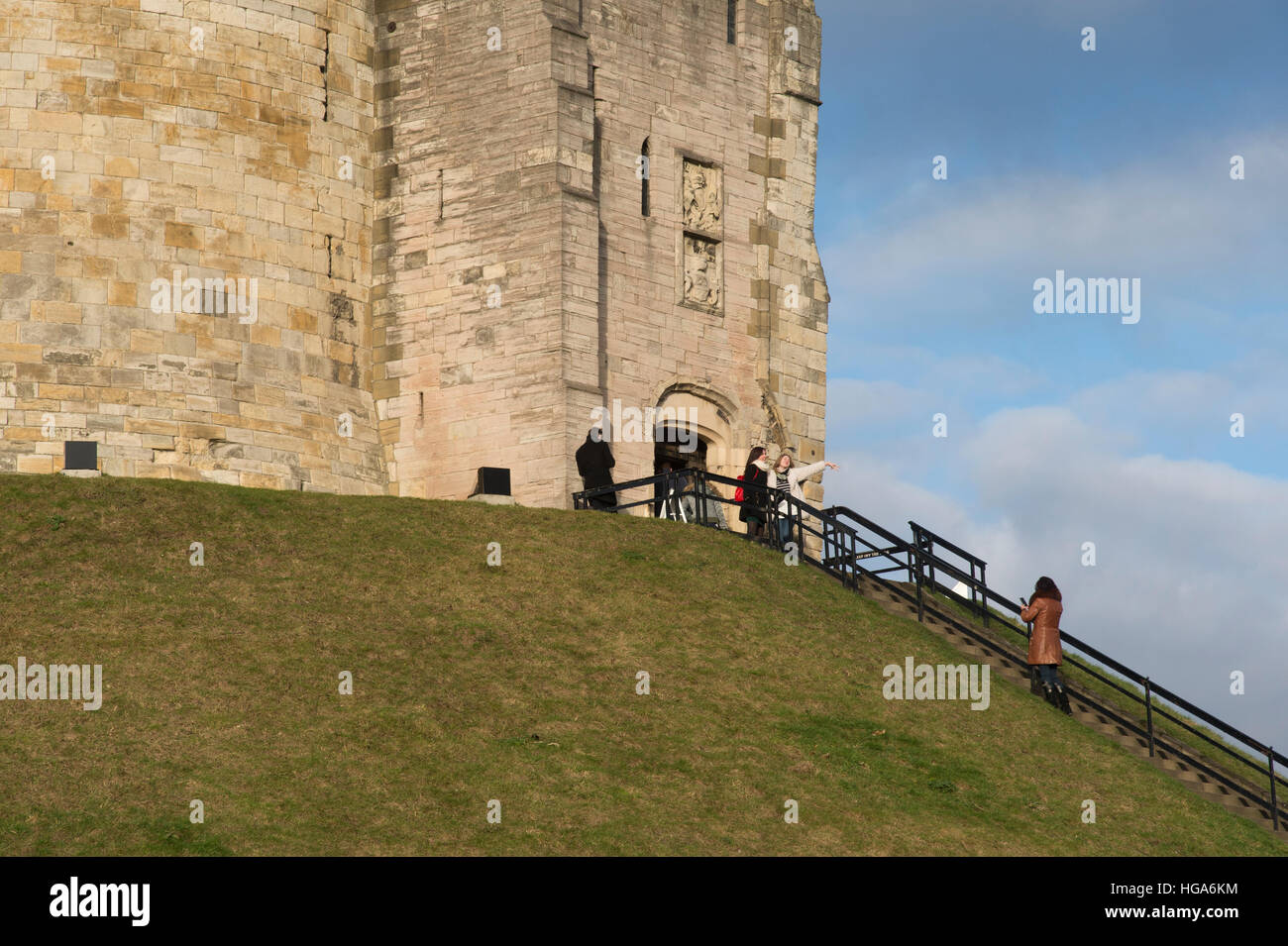 Clifford’s Tower entrance visitors take photos & pose at historic