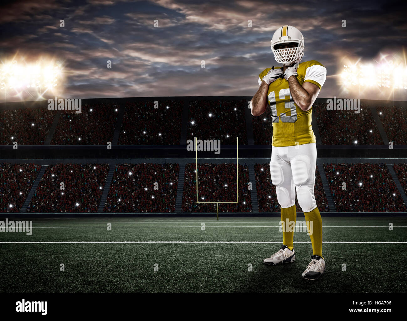 Football Player with a yellow uniform on a stadium Stock Photo Alamy