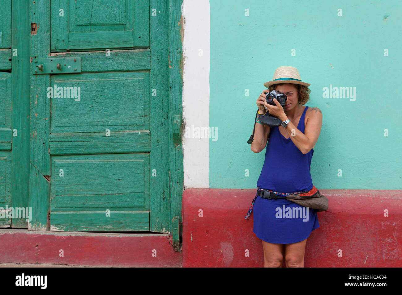 Girl tourist on her 20 30 years old taking photo in Trinidad, Cuba Stock Photo