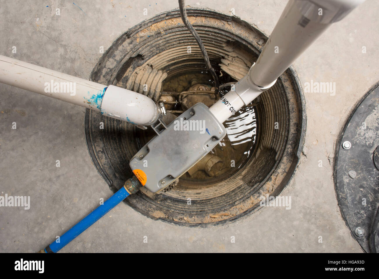 A sump pump installed in a basement of a home with a water powered