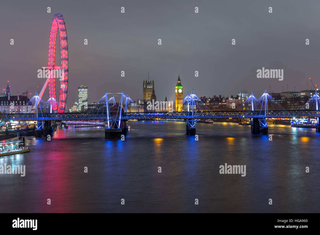 London skyline at night with embankment bridge, big ben and houses of parliament at the background, as seen from the waterloo br Stock Photo