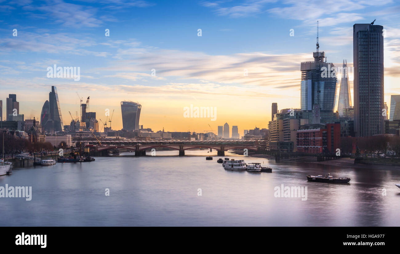 London skyline toward embakment bridge and big ben, as seen from waterloo bridge at sunrise Stock Photo