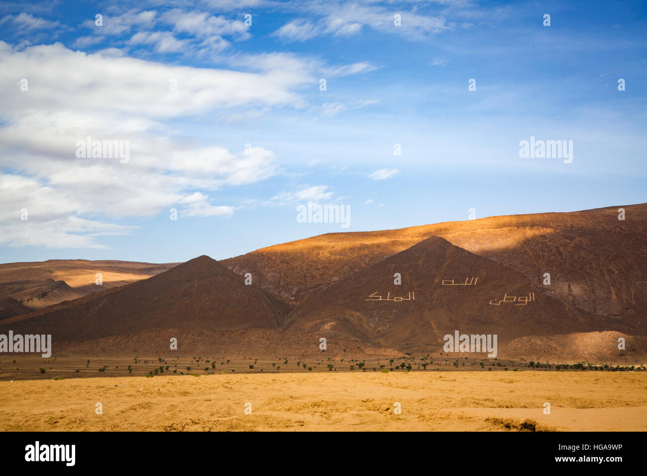 Moroccan national motto "God, Homeland, King" made of stones in the  mountains of southern Morocco Stock Photo - Alamy