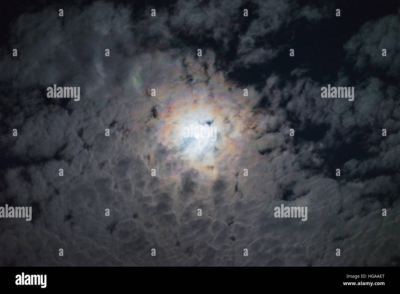Night full moon bright clouds halo effect cloud sky mystery spooky lunar atmosphere weather Stock Photo