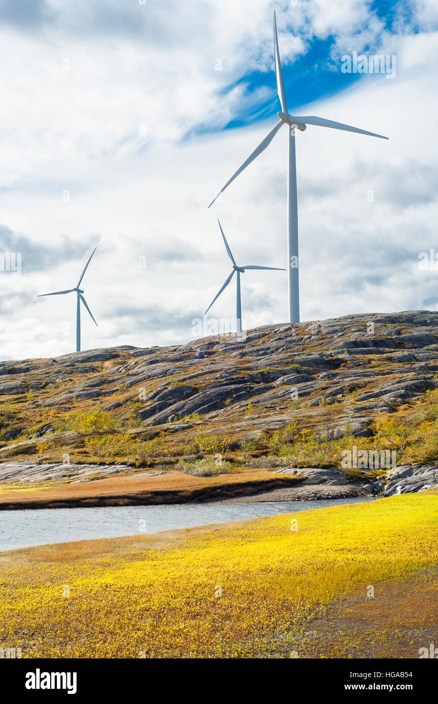 Wind turbines in a wind powered renewable energy production plant in barren landscape of north Norway Stock Photo