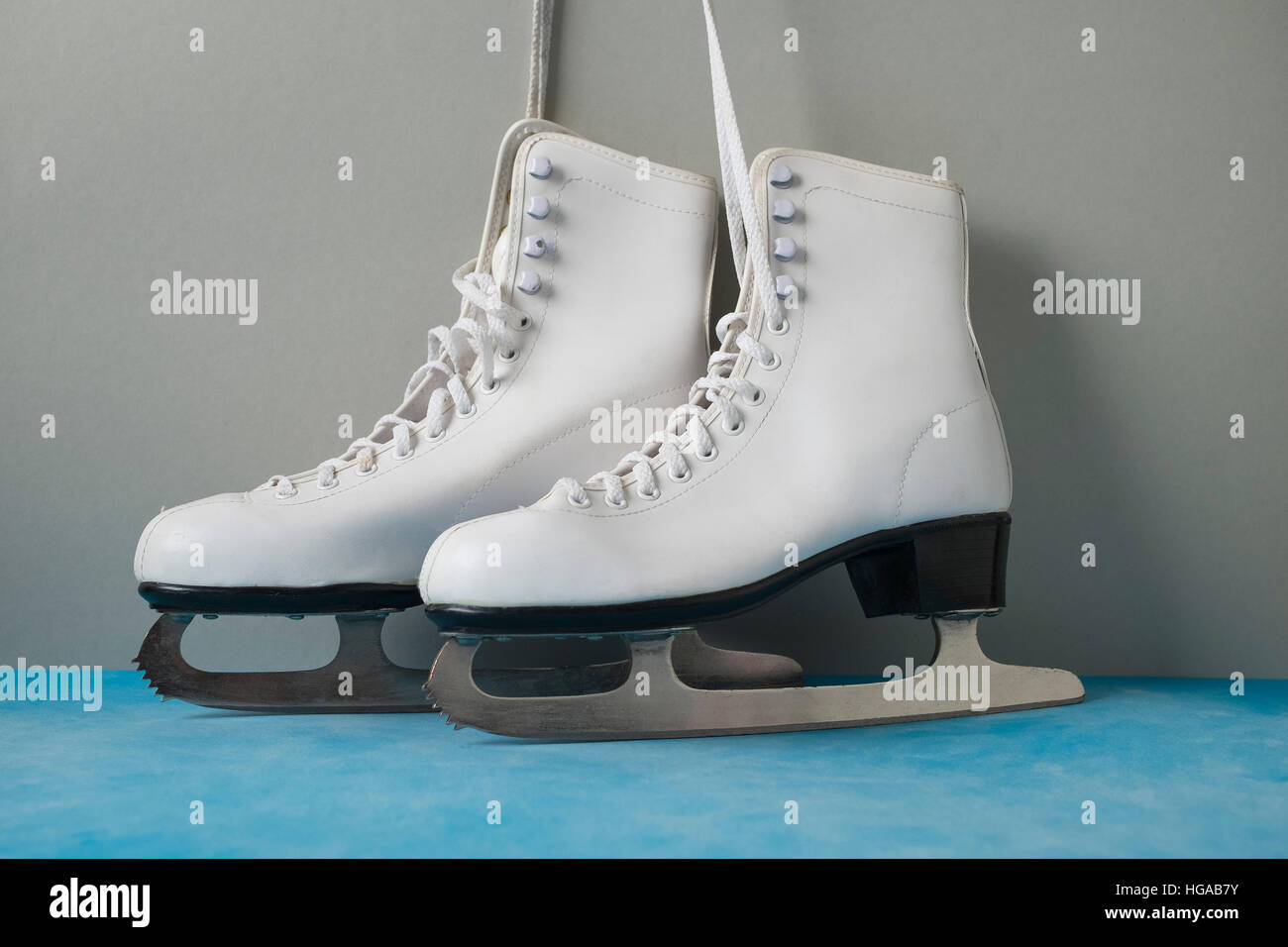 Vintage ice skates on the blue vintage background Stock Photo Alamy