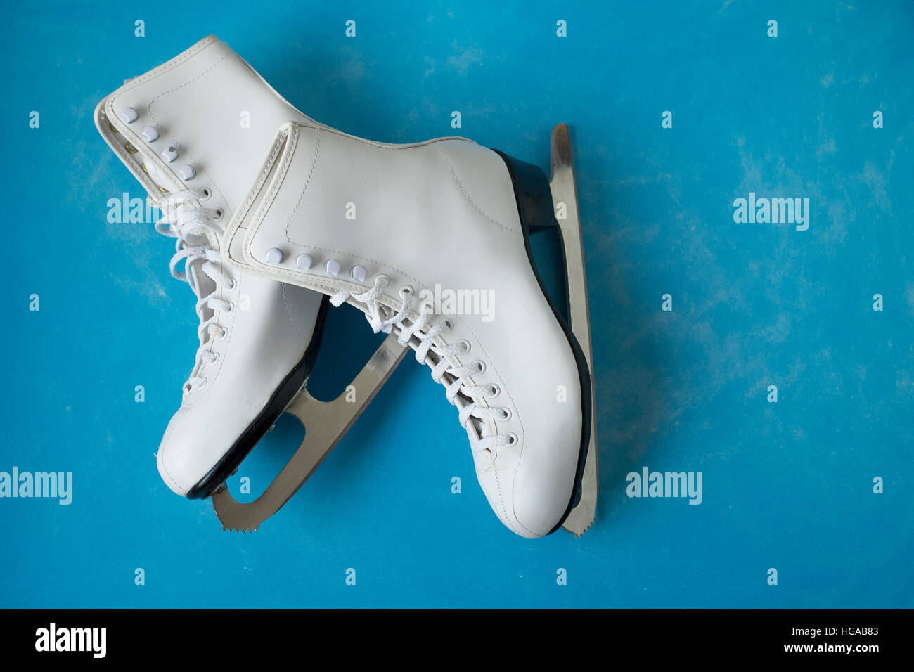 Vintage ice skates on the blue vintage background Stock Photo Alamy