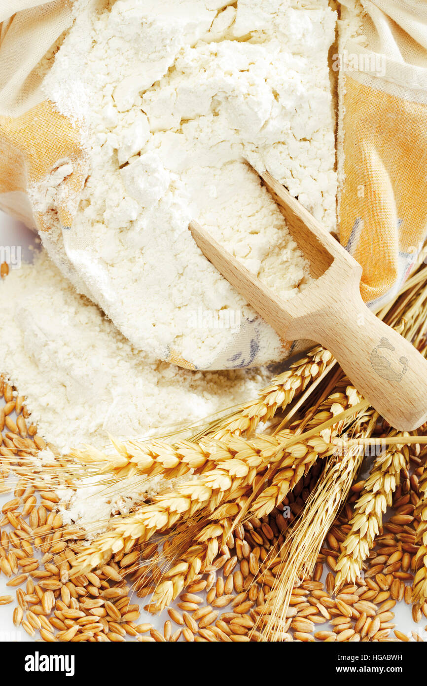Grains with flour and wooden scoop Stock Photo - Alamy