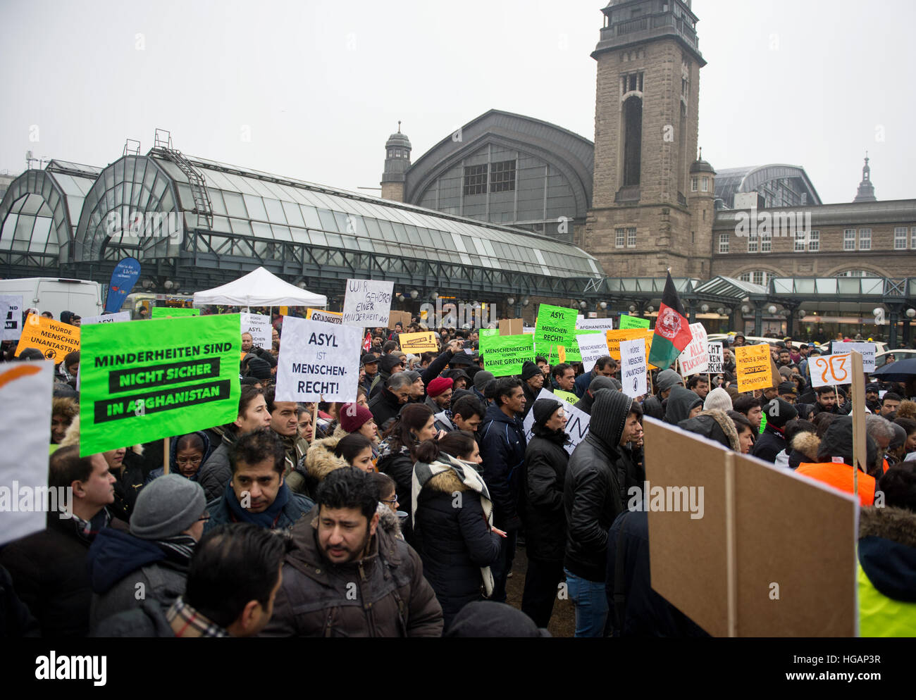 Hamburg, Germany. 7th Jan, 2017. Demonstrators holding banners that read 'Minderheiten sind nicht sicher in Afghanistan' (lit. minorities are not safe in Afghanistan) and 'Asyl ist Menschenrecht!' (lit. Asylum is a human right) during a demonstration against deportations to Afghanistan, in Hamburg, Germany, 7 January 2017. The Afghan Hindu community and the Hindu temple called the demonstration. Photo: Daniel Reinhardt/dpa/Alamy Live News Stock Photo