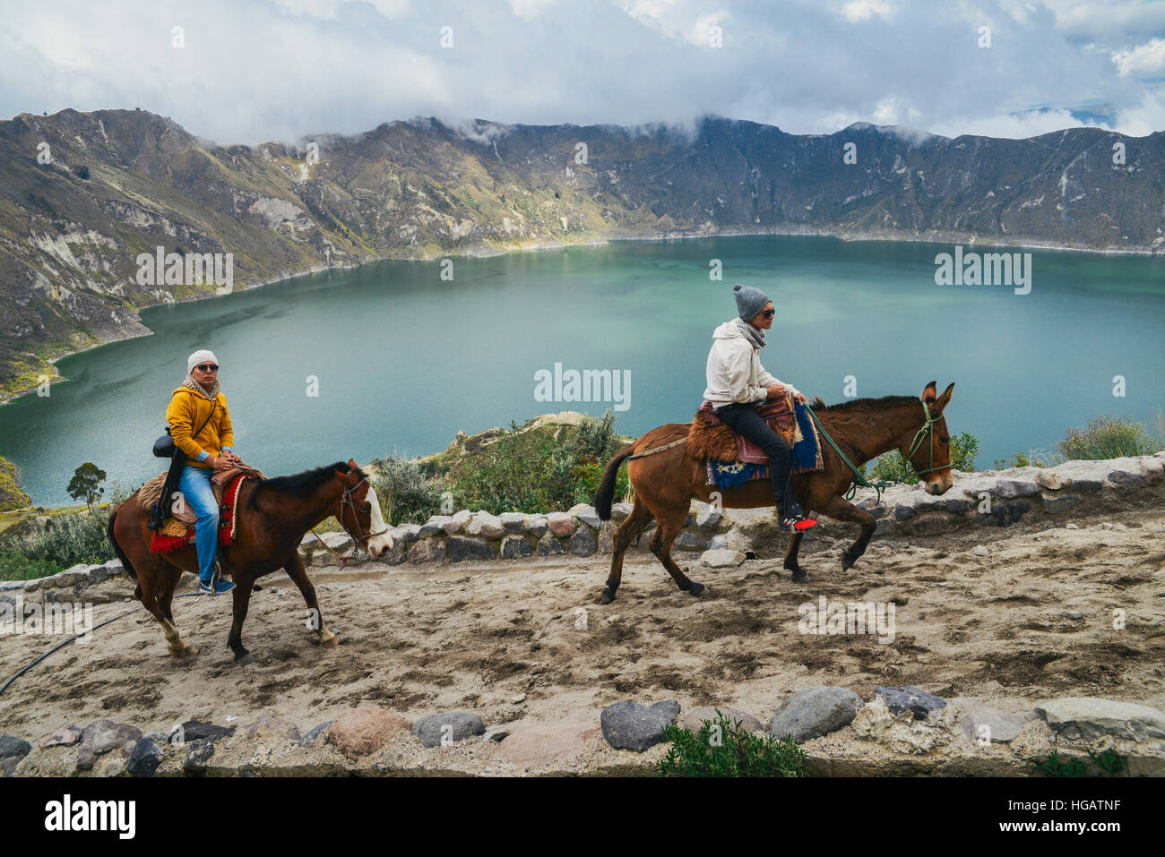Horse riders on the trail around the Quilotoa, Volcano Stock Photo