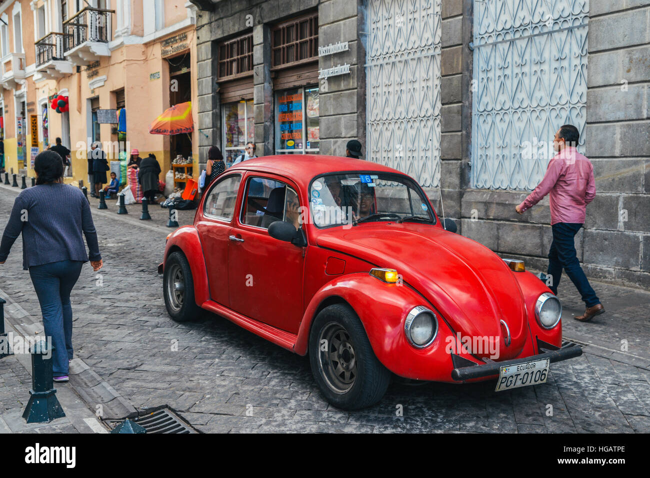An old red beatle on the streets of the capital city of Quito, Ecuador, South America near the famous 'La Ronda'. Stock Photo