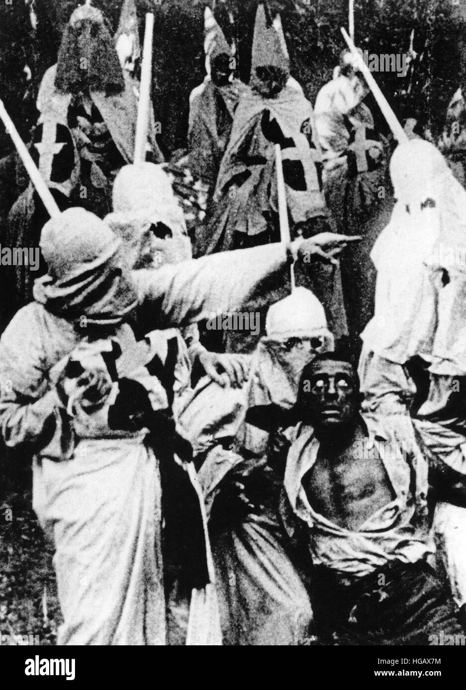 THE BIRTH OF A NATION 1915 D.W.Griffith silent film. White actor Walter Long in blackface as Gus in the grip of the KKK.  In the film captions he is described as '...a renegade, a product of the vicious doctrines spread by the carpetbaggers' Stock Photo